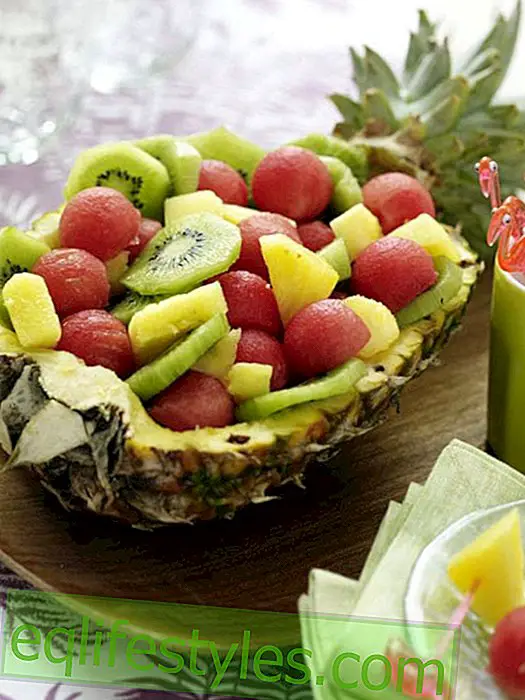 Half pineapple with fruit salad