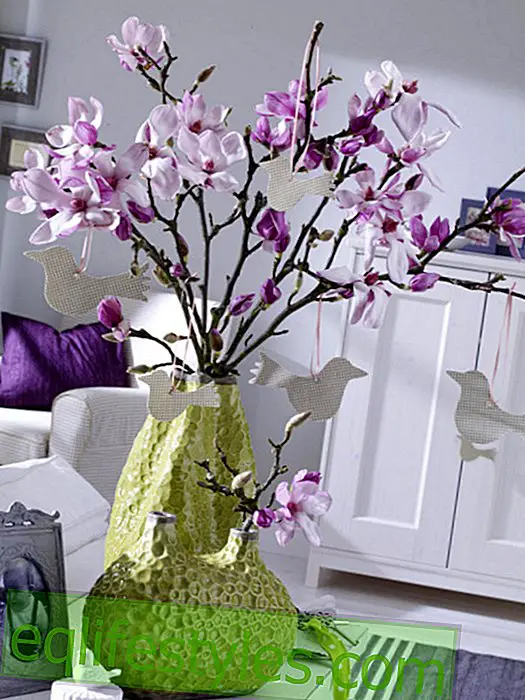 Magnolia branches with bird pendants made of fabric