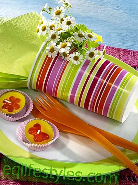 Single place for garden party: paper cup as a napkin ring
