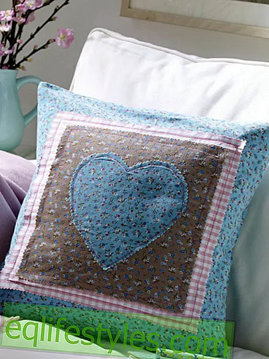 Patchwork pillow with heart application